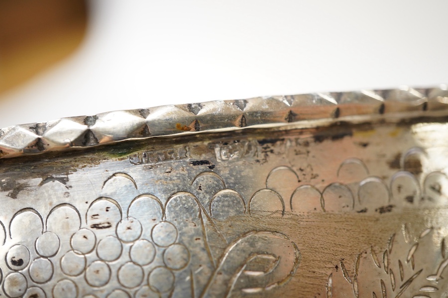 A continental circular white metal bowl with engraved fruiting vine decoration, diameter 19.8cm, 14oz.